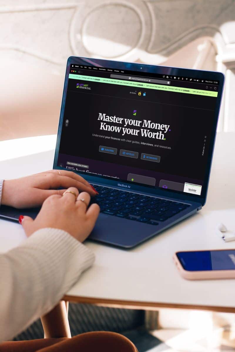 Woman using laptop for education on Let’s Get Financial website